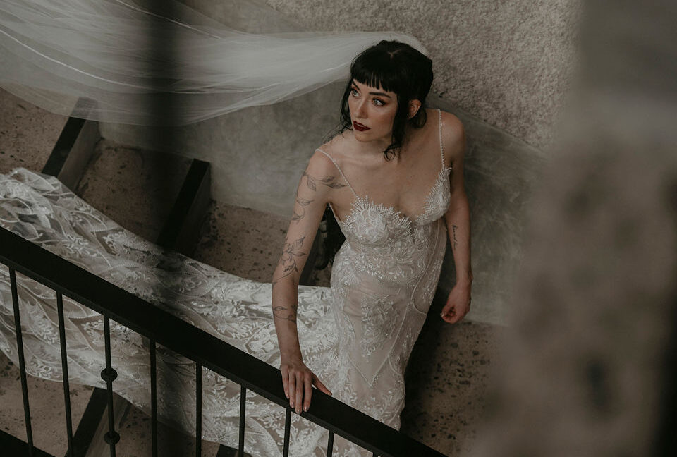 How to Plan a Destination Wedding - Photo of a bride in the stairs of The Castle of Oz, a Costa Rica Wedding Venue