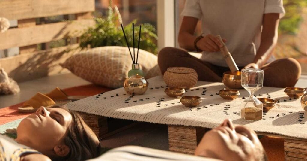 Guests immersed in a sound healing session at a Spiritual Healing Retreat in Costa Rica, embracing relaxation and self-discovery at The Castle of Oz, a secluded castle in the jungle.